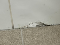 Broken tile in bathroom