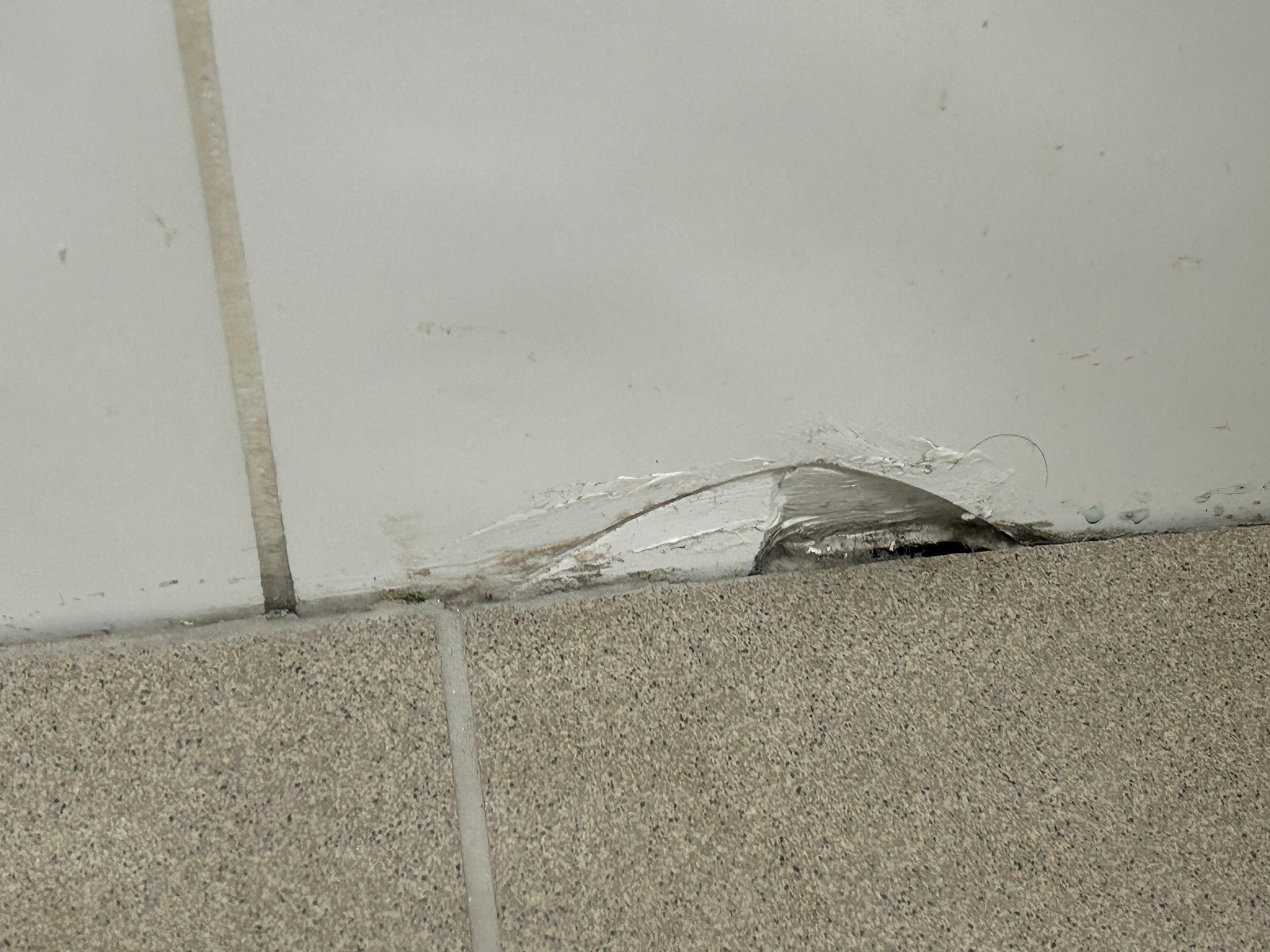 Broken tile in bathroom