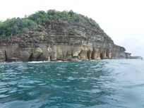 Hire a local boat to take you 20 minutes to this island for snorkeling in very clear water with many tropical fish