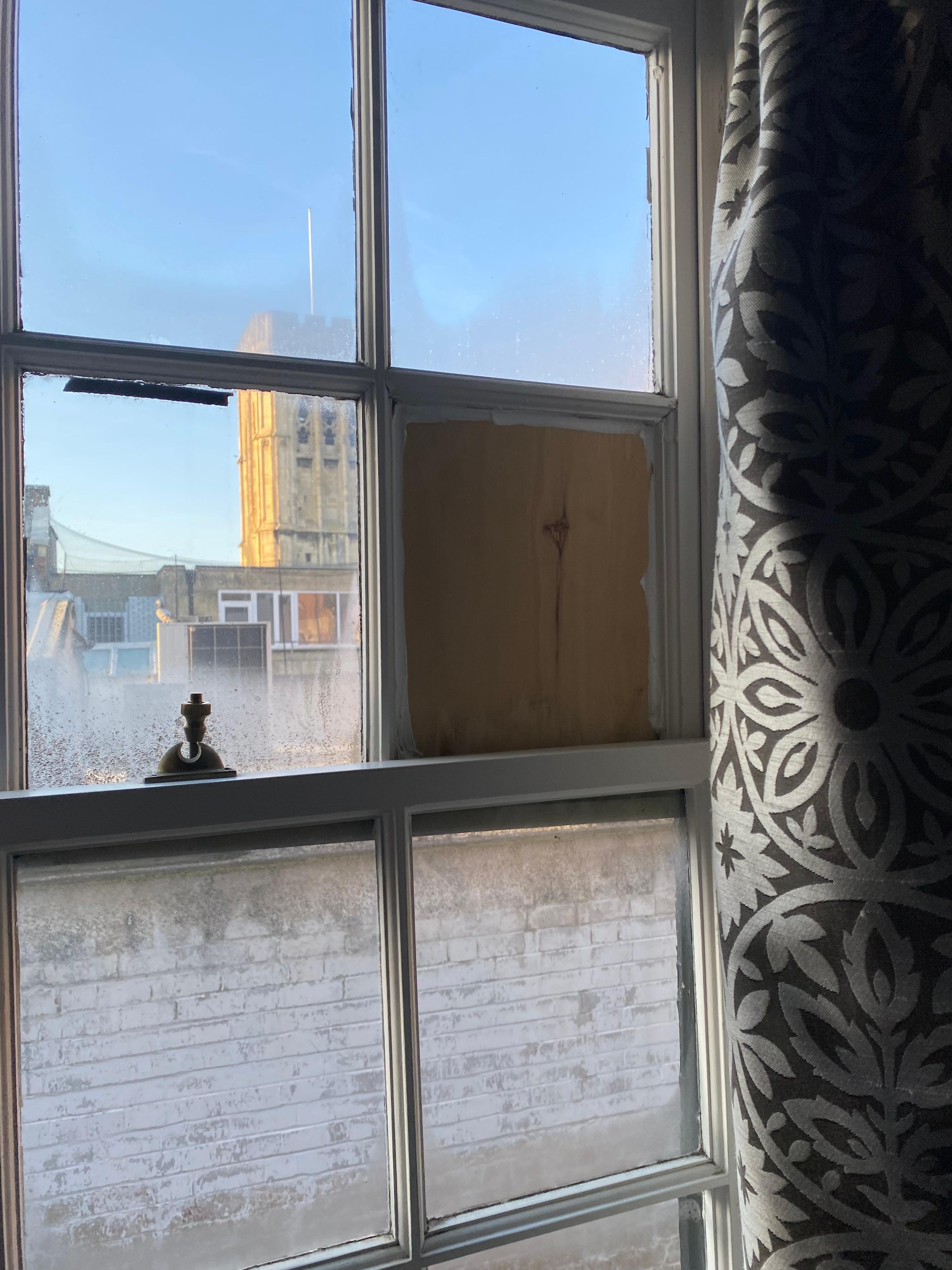 Window pain missing and boarded up