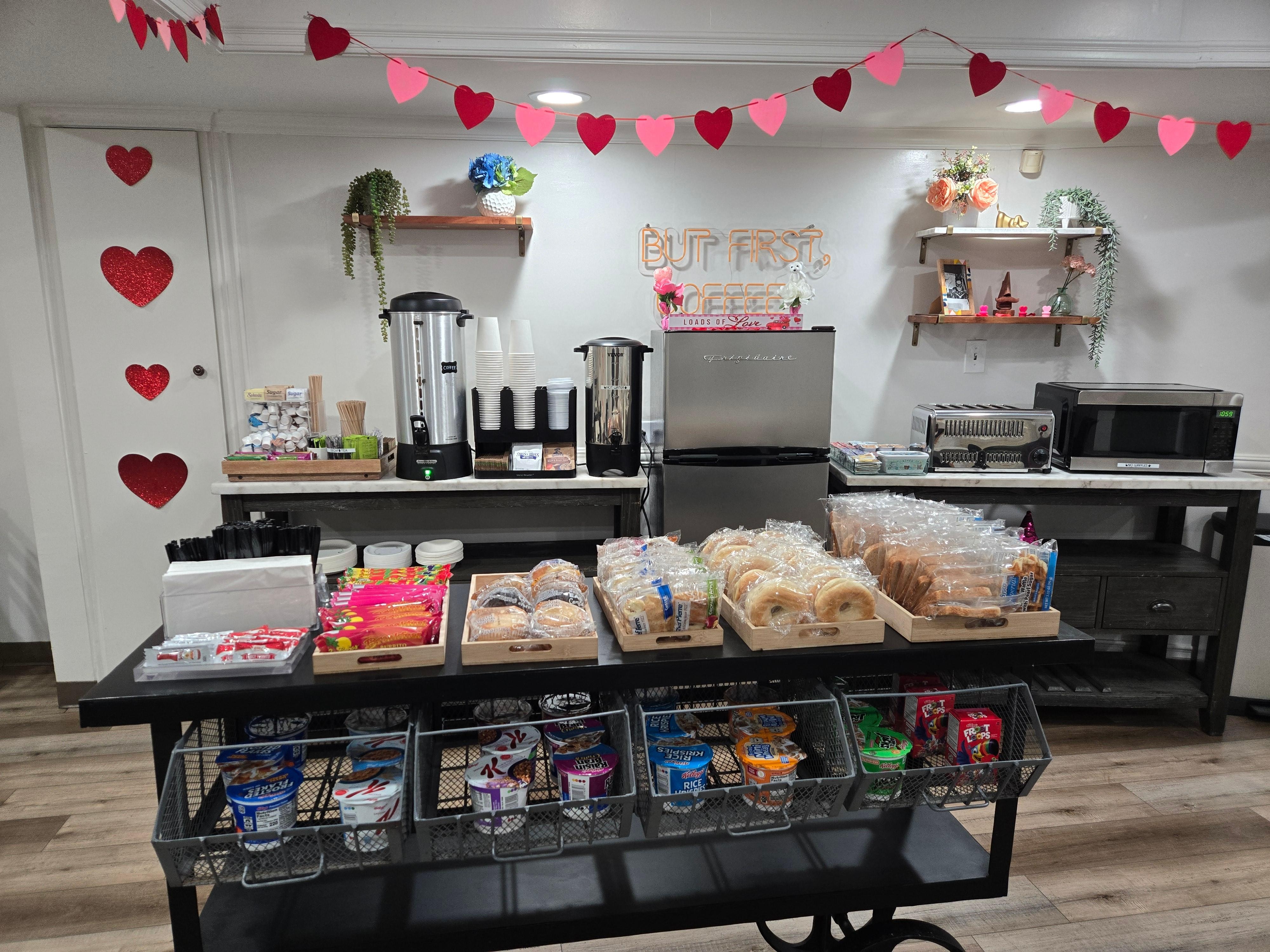 Breakfast included with stay. Bagels, muffins, granola bars, burritos, pastries, juice, coffee, milk, etc.