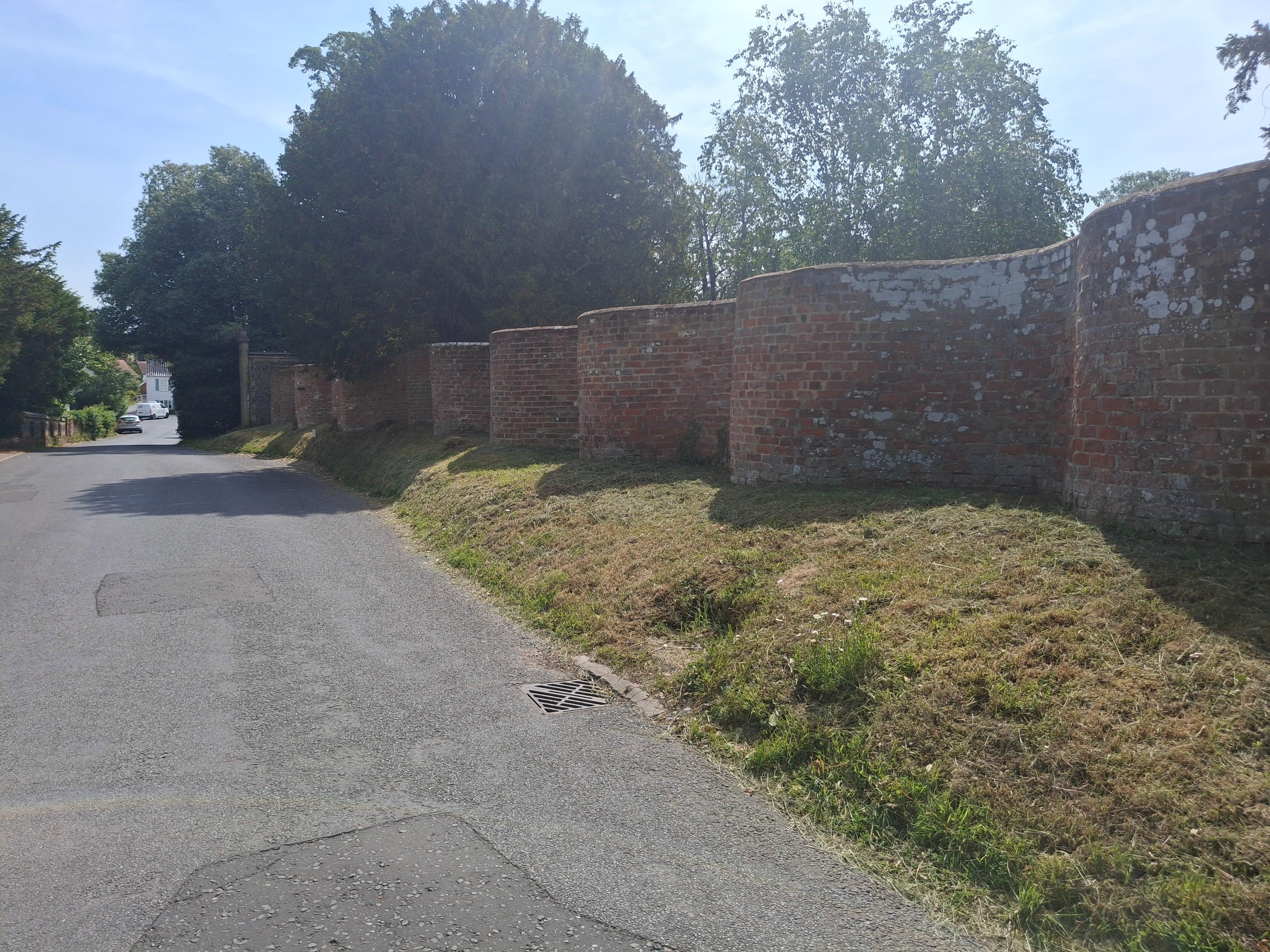 The wall opposite the church in the village.  I believe it's called crinkle crinkle wall