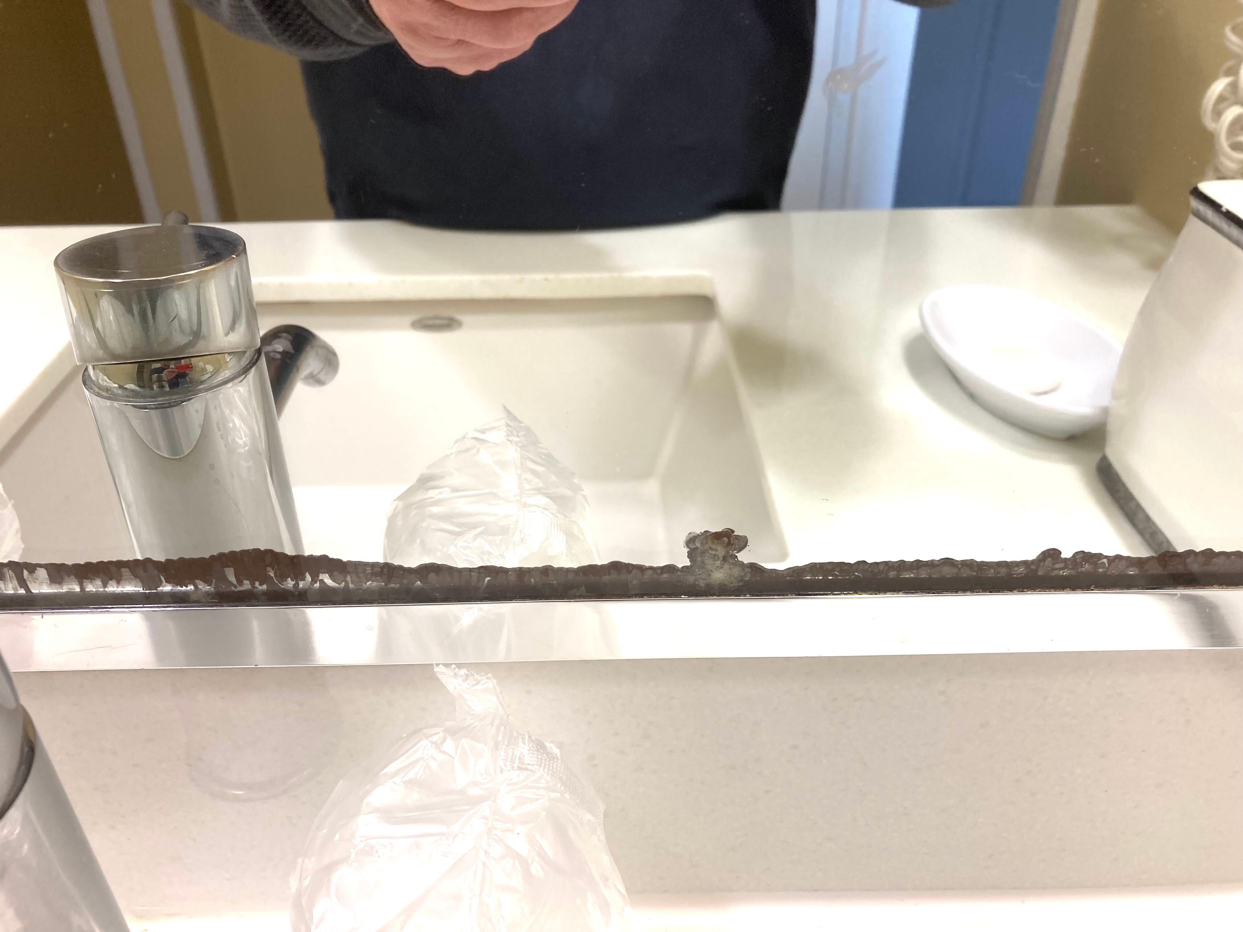 Delaminating bathroom mirrors