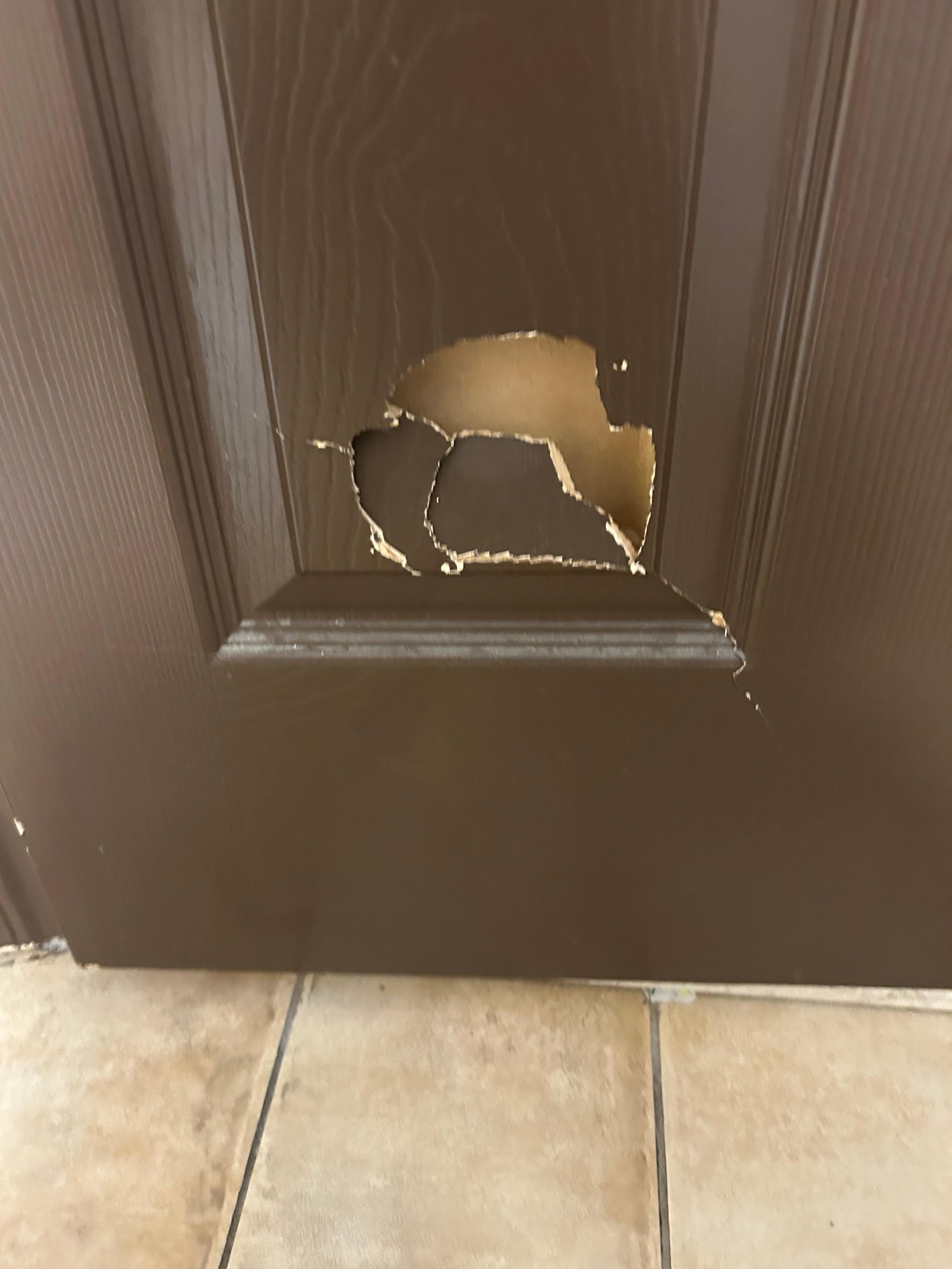 A hole in the bathroom door