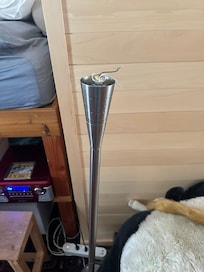 Lamp with exposed wires in main area of playroom