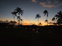 A view walking to the beach at sunset