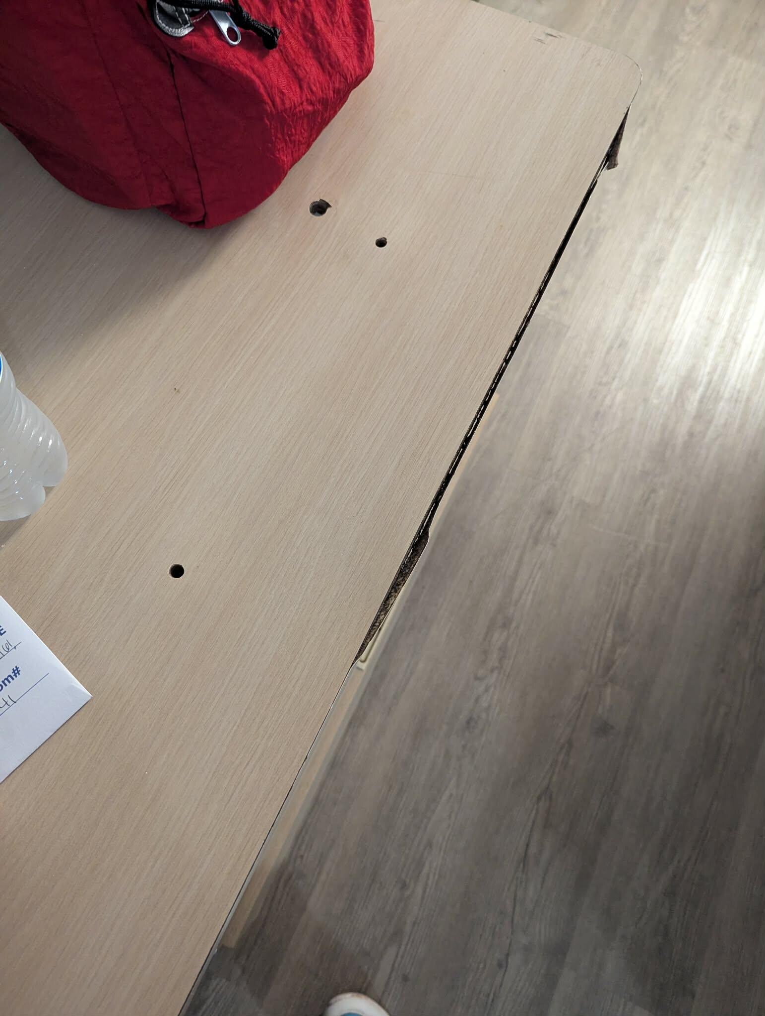 Holes and other damage to the dresser