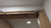 Top part of door frame fell onto us as we entered the room