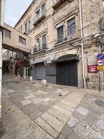 View of pharmacy on side of hotel in alley. Yes, they sell distilled water for CPAP machines :-)