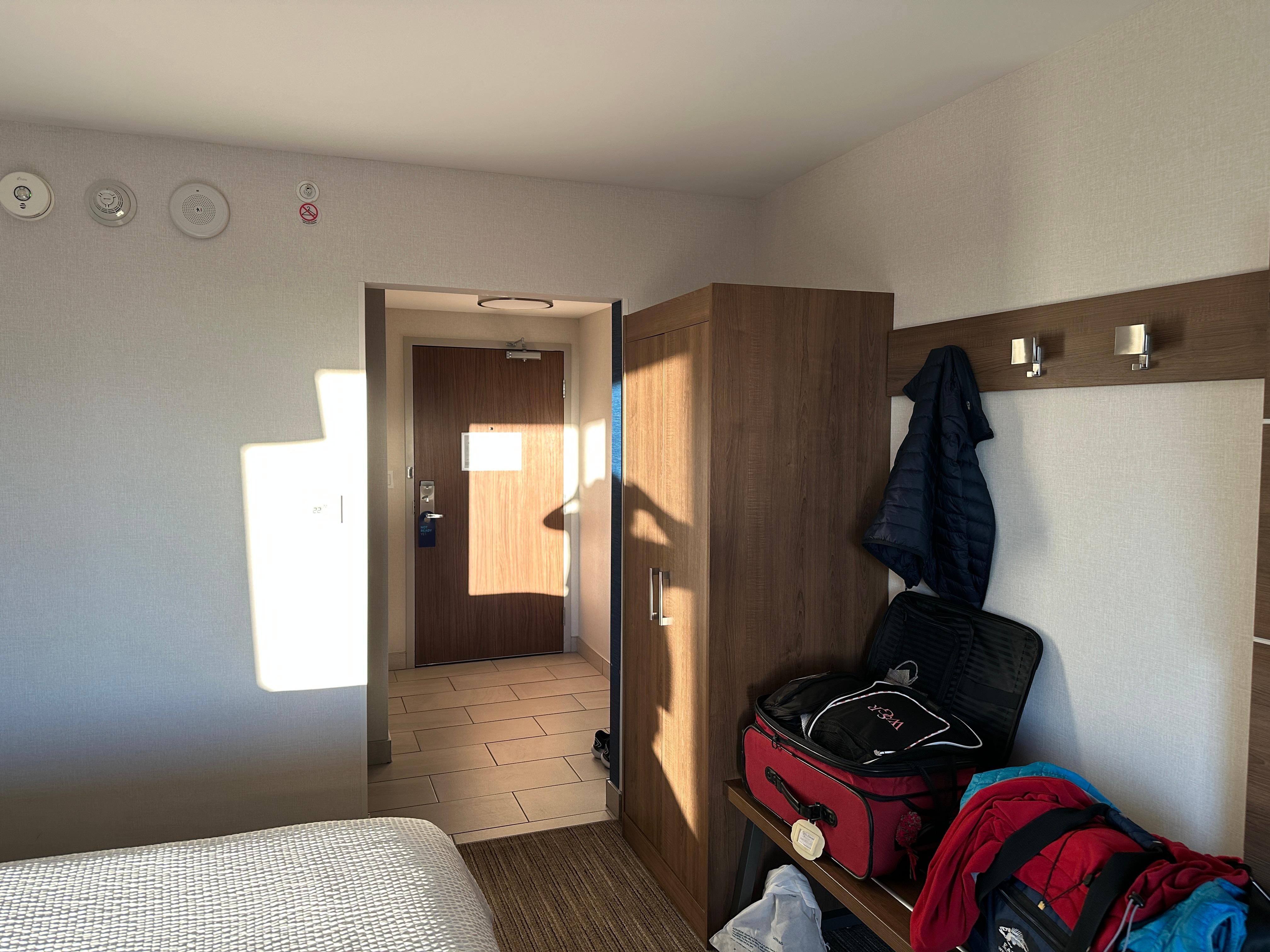 roomy, clean, hooks for coats, handy spot to open up two suitcases