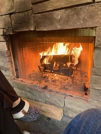Porch fireplace near stream