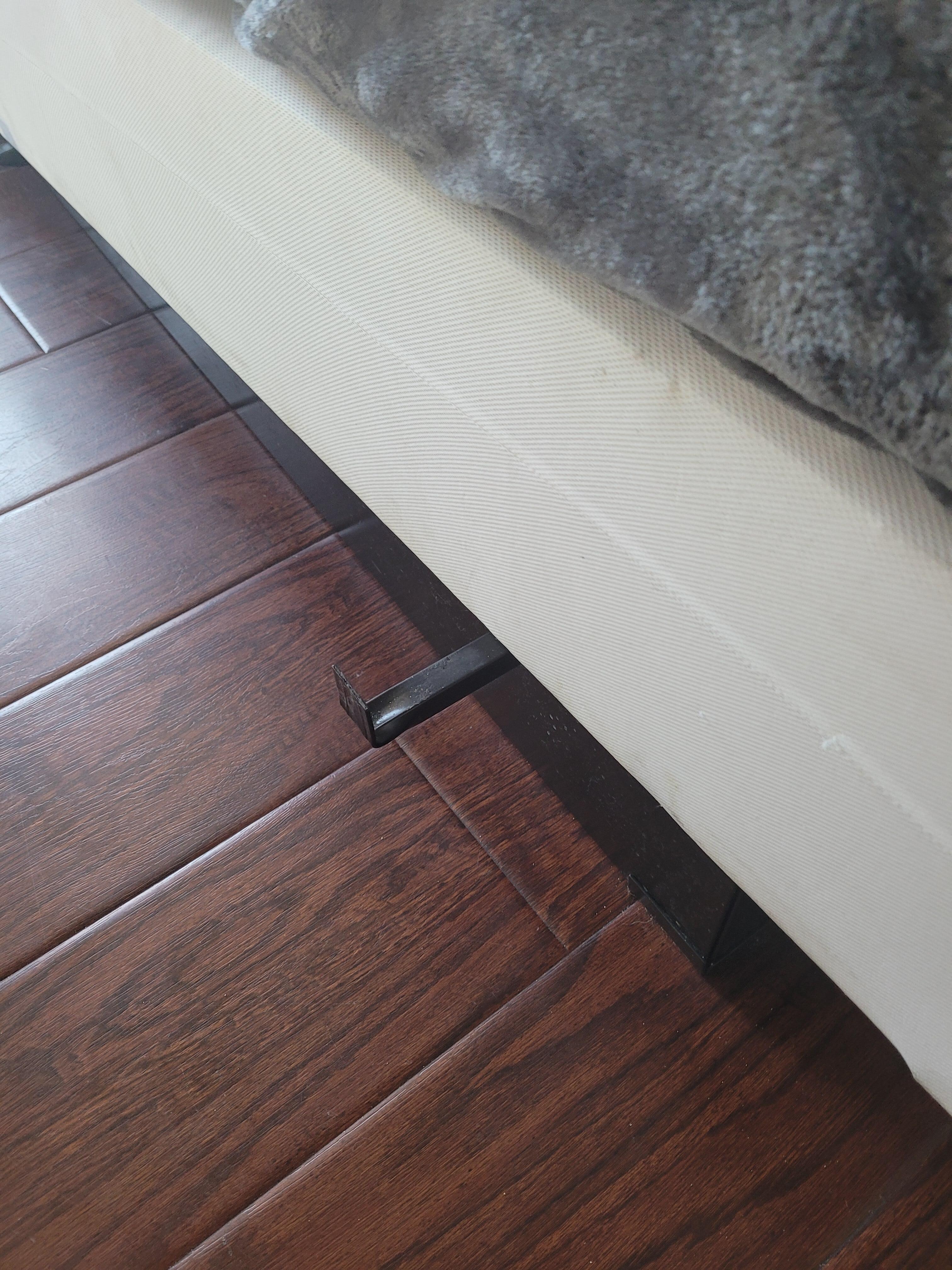 Railroad size spike sticking out from under the bed.