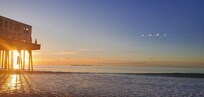 Sunrise on the beach in front of condo.