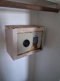 Safe located in the room. Rusted and unusable.