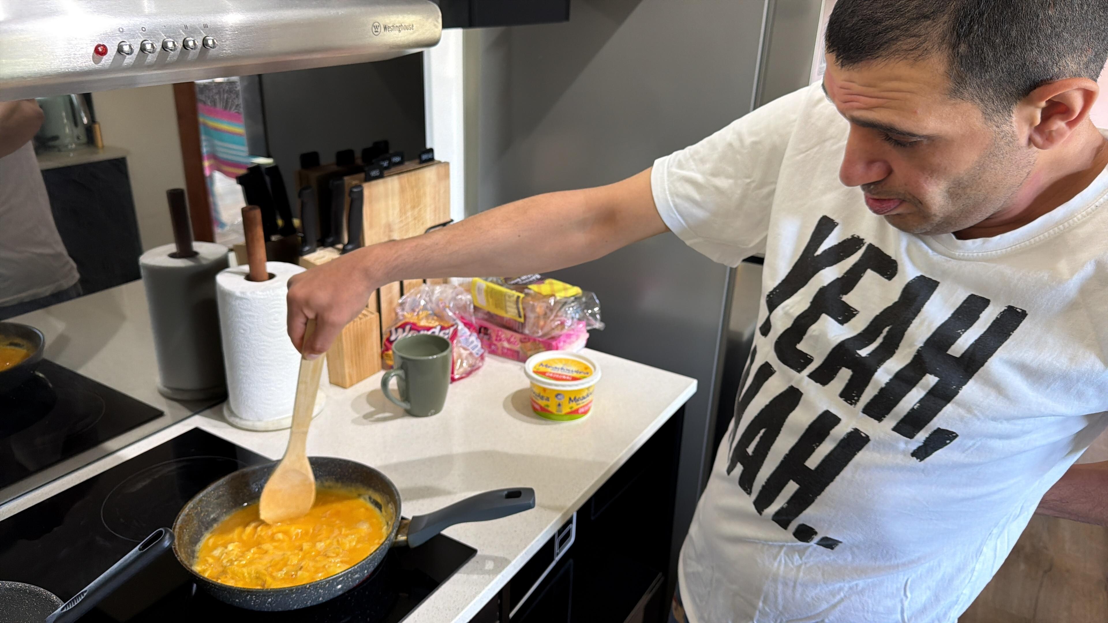 One of my family members enjoying cooking in the well-equipped kitchen.