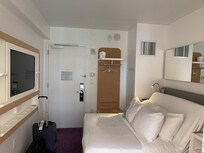 Sofa that becomes bed at touch of button.