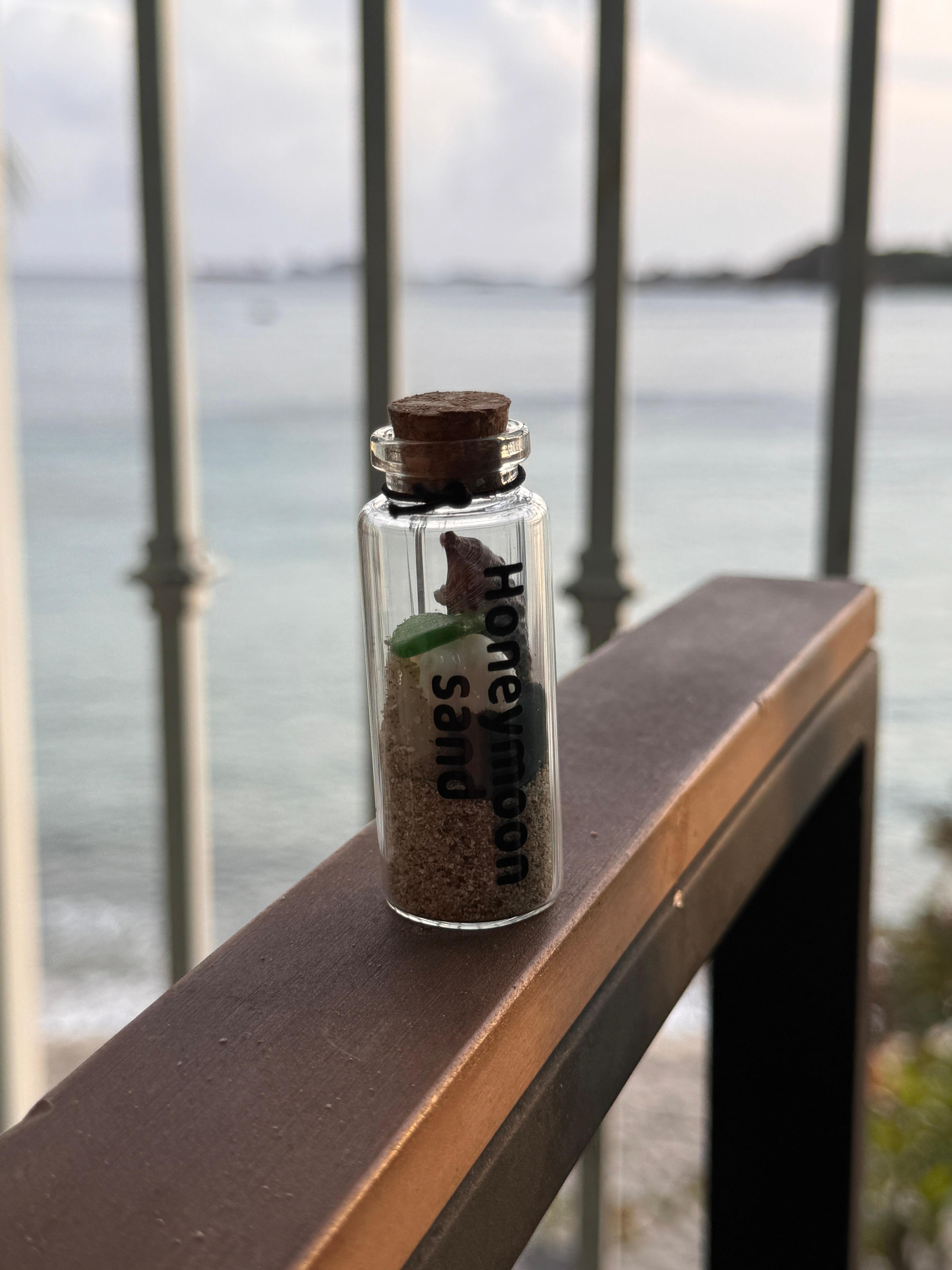 This was our honeymoon so I gathered some sand and found a bunch of cool shells, rocks, and sea glass. 