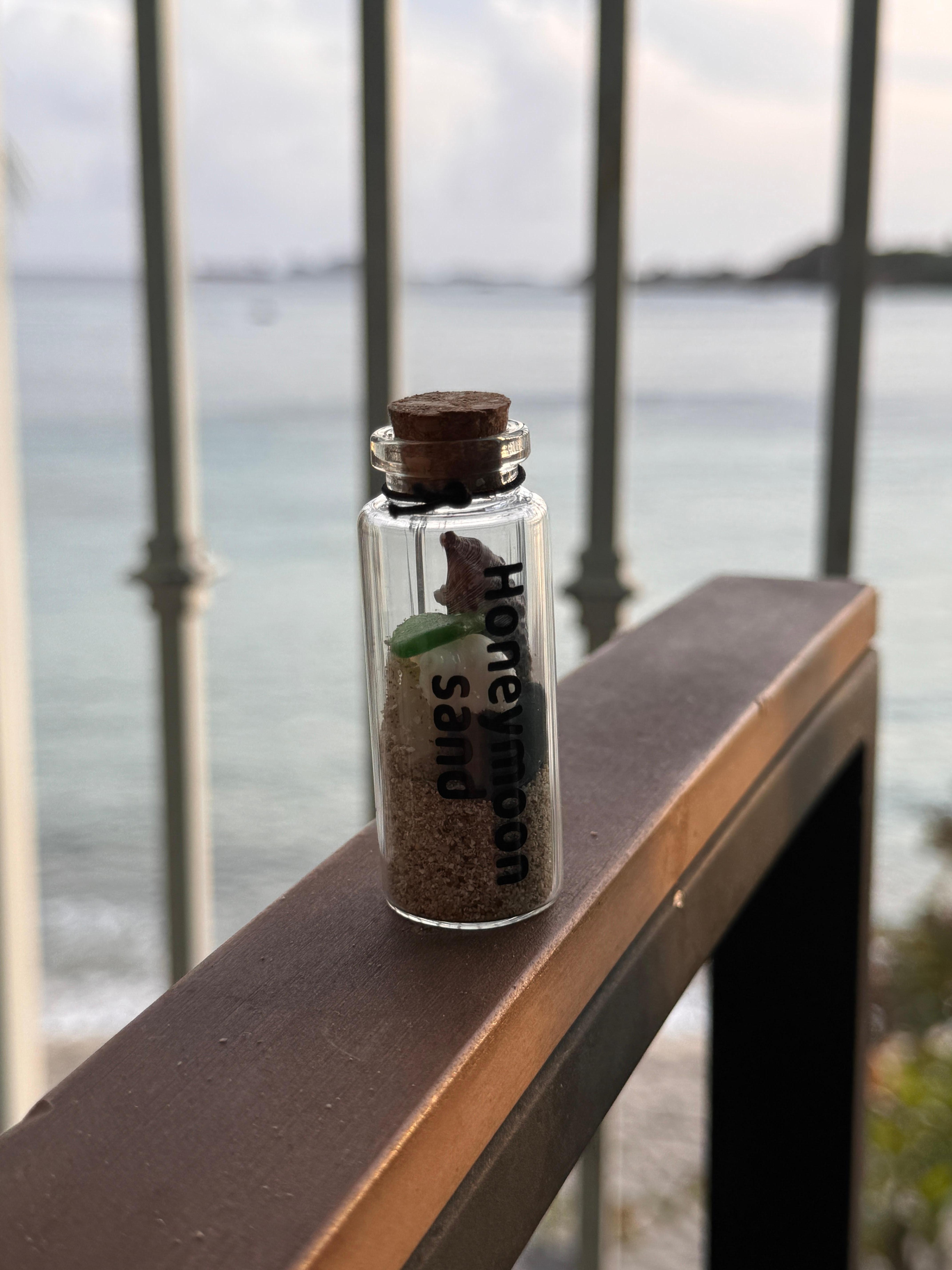 This was our honeymoon so I gathered some sand and found a bunch of cool shells, rocks, and sea glass.