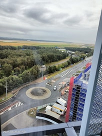 Looking at the view, of the lovely pool, and can see a plane on the runway 9th Floor.. awesome