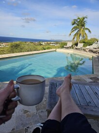 Morning coffee in the shade by the pool, look at that view!