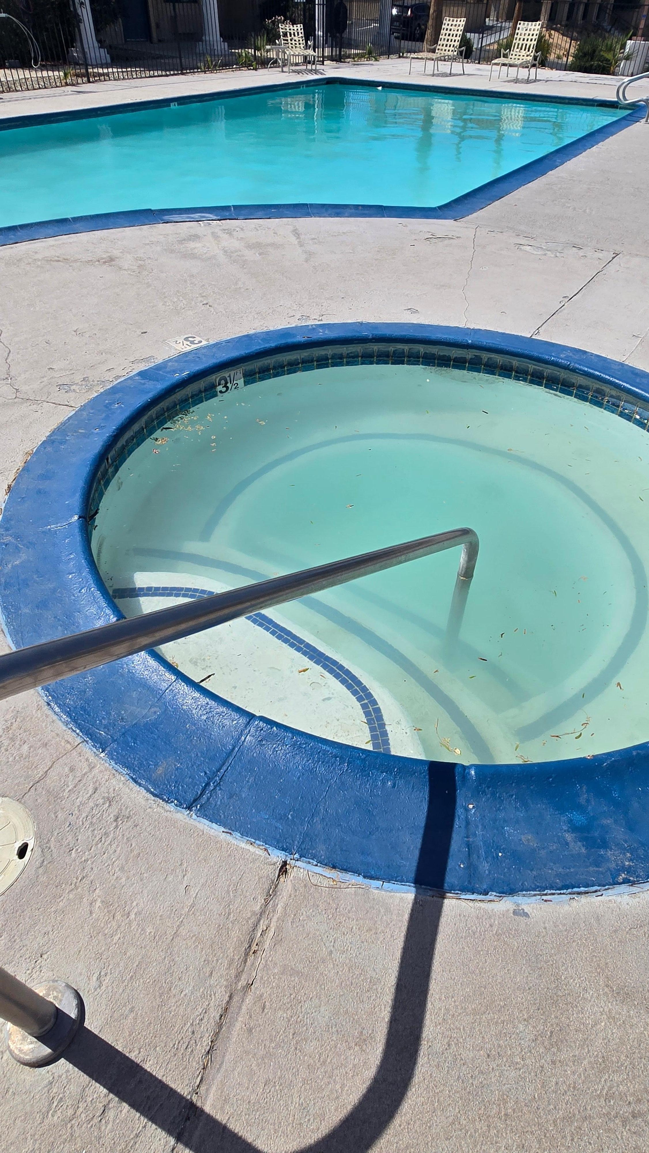 Dirty Pool water, floating trash.