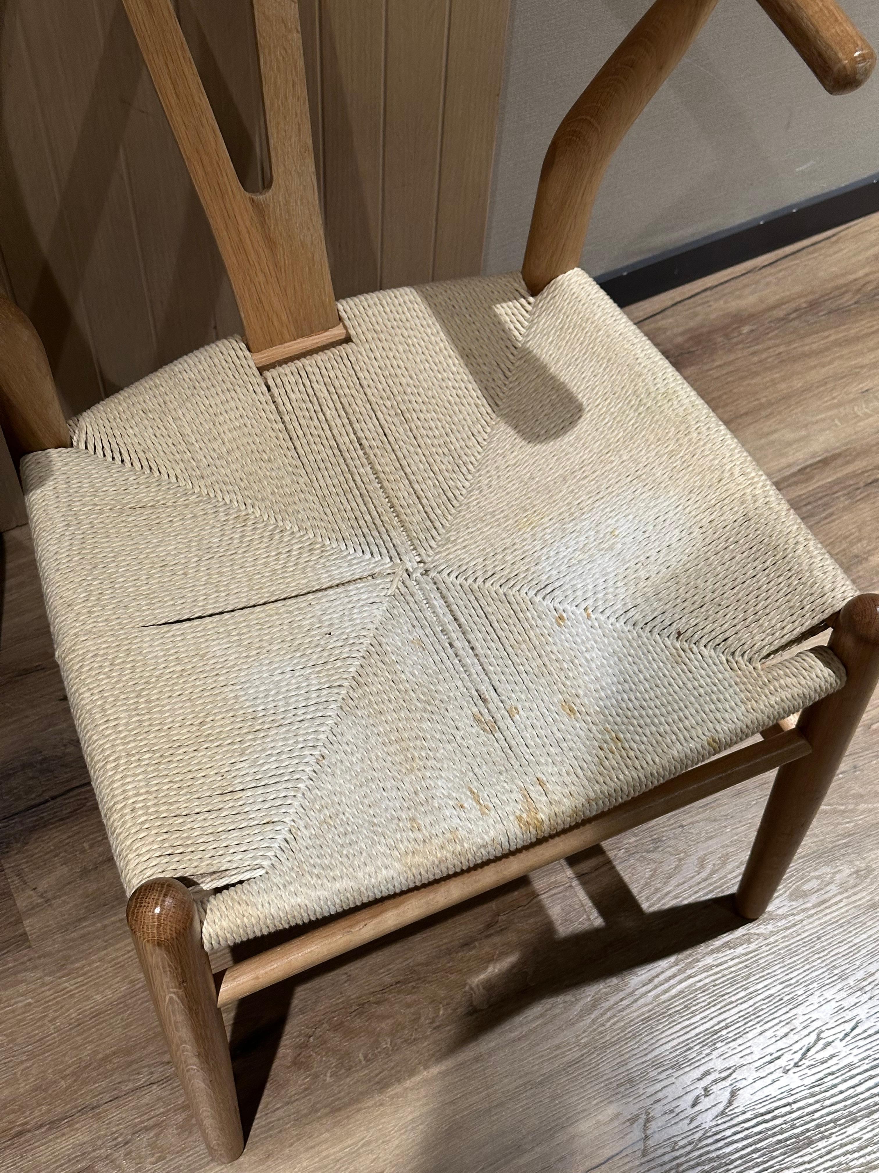 stained chair inside of the room.