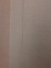 Peeling wallpaper in multiple locations in the room