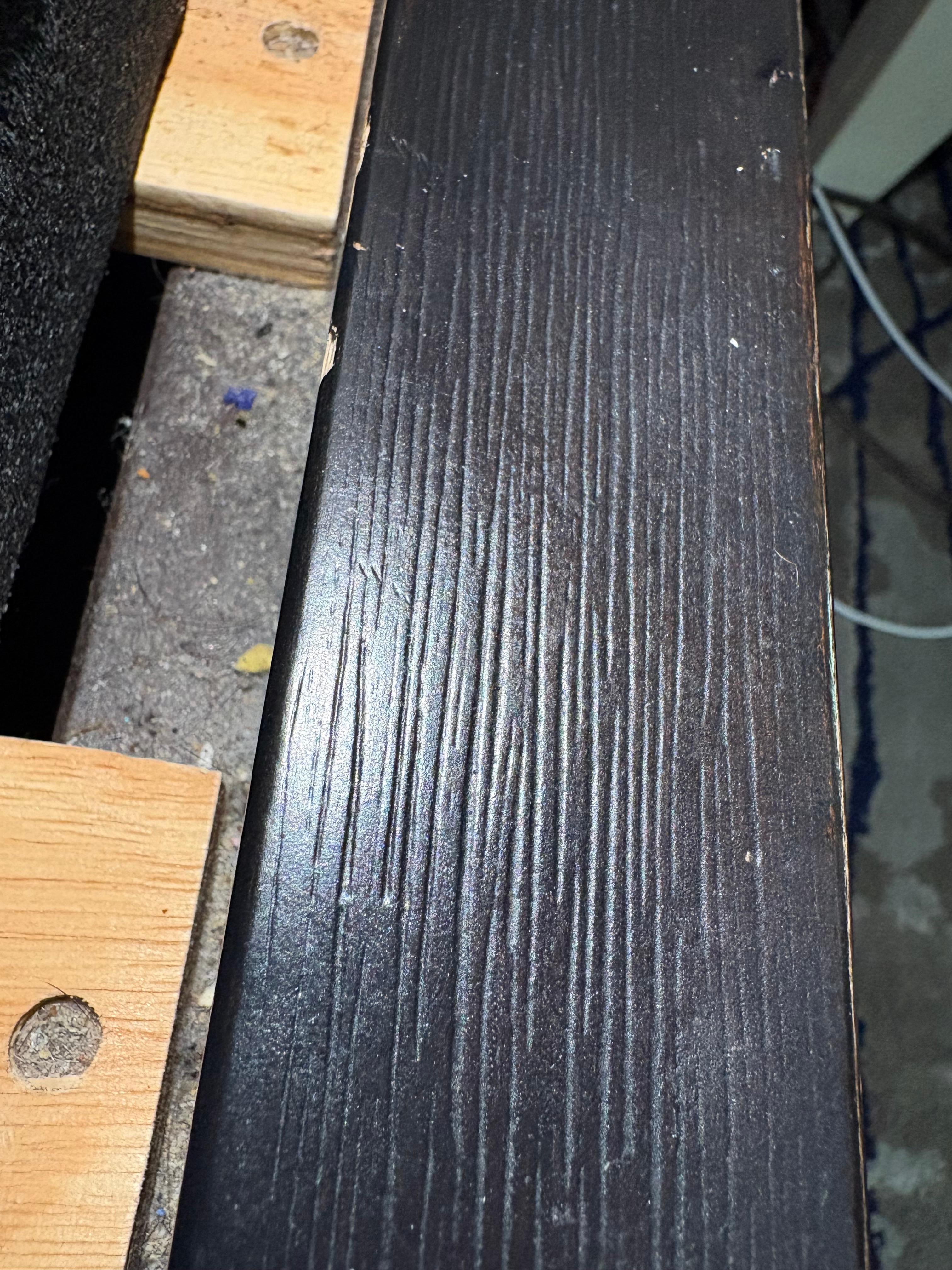 Crumbs, dust at the side of the bed 