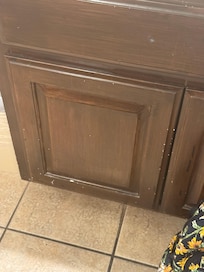 Old chipped cabinets in bathroom