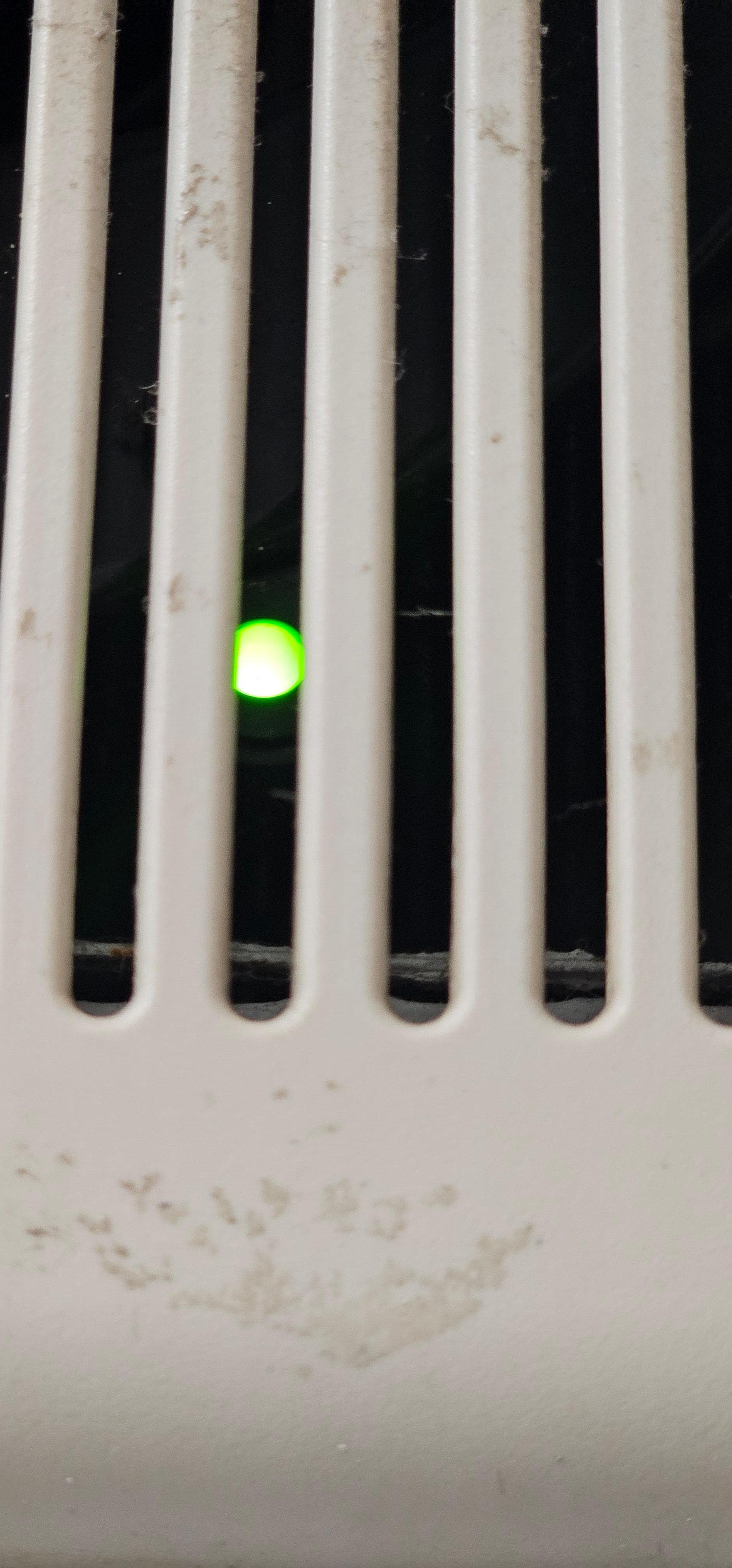 Flashing green light in the bathroom. 