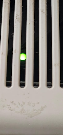 Flashing green light in the bathroom.