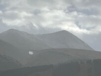 View of snow descending on the mountains