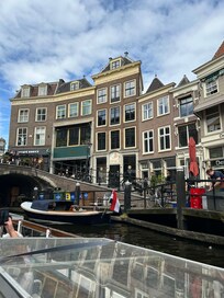 Top 2 floors of the tall building in centre.