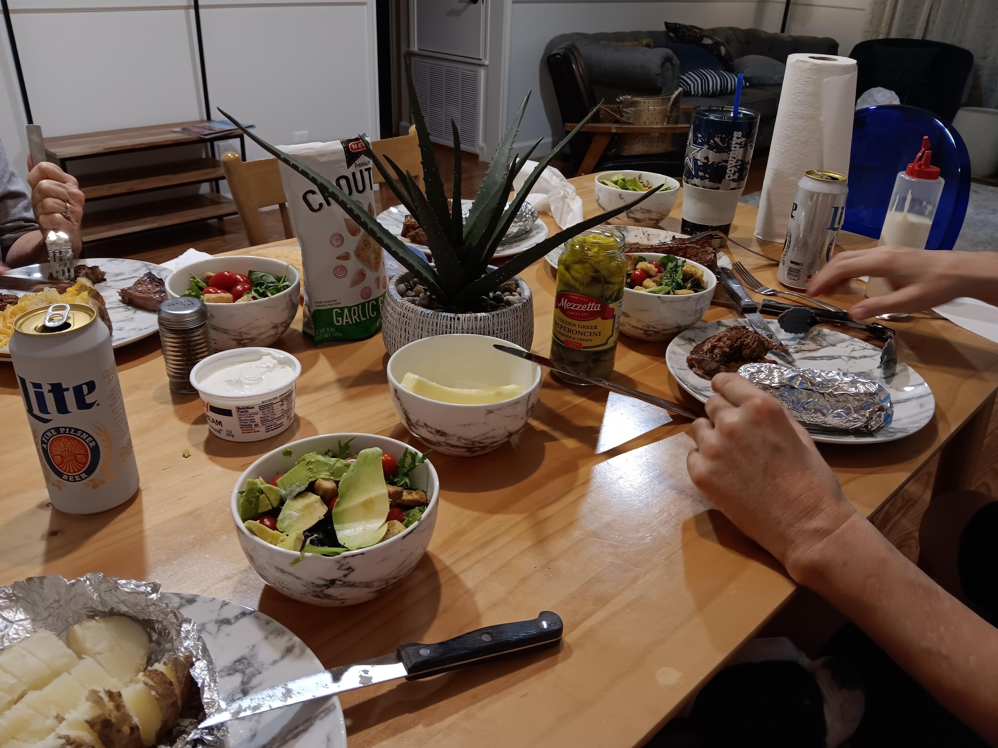 Enjoying a nice dinner, grilled steaks with all the fixings (gas grill on back patio)