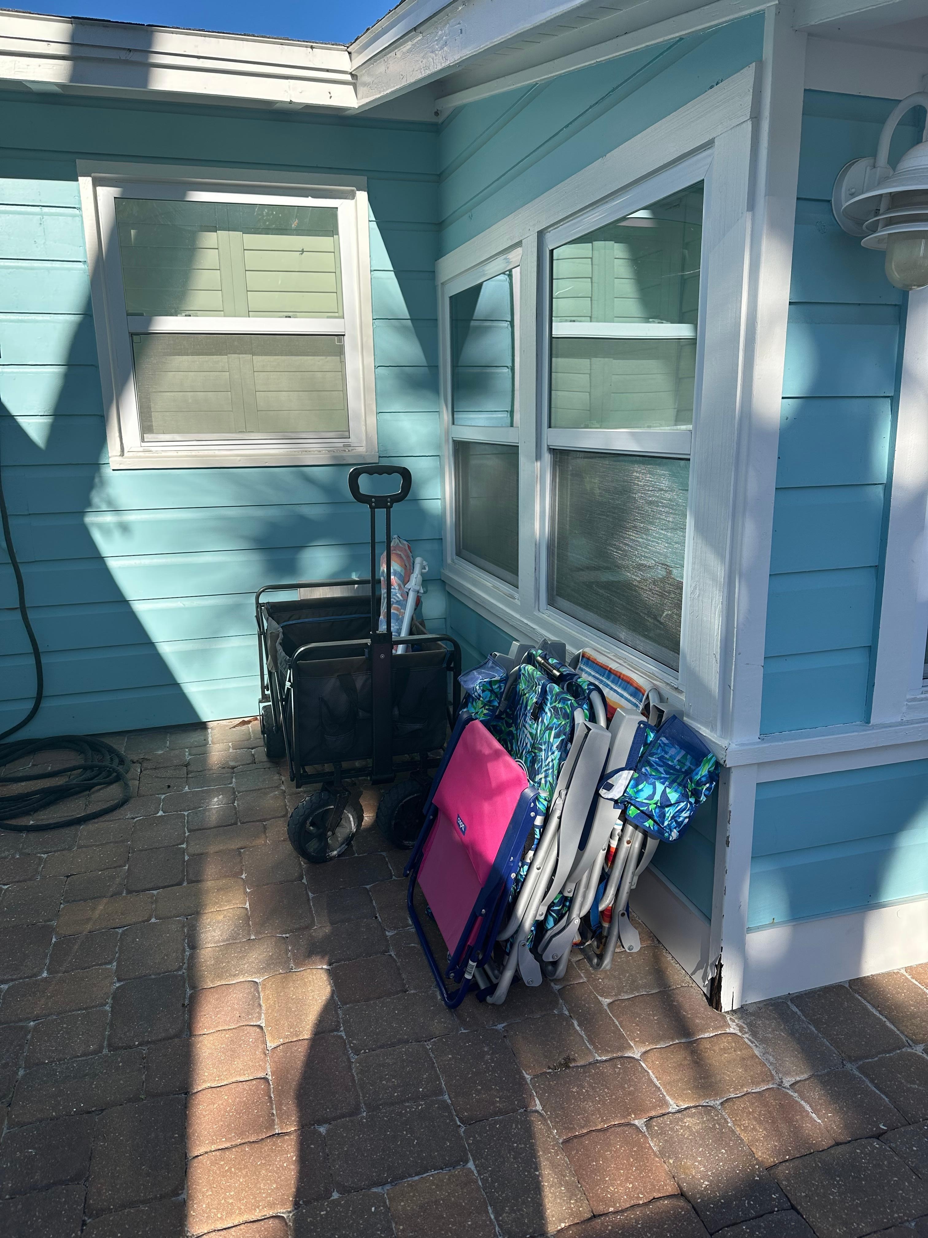 Beach wagon, chairs and umbrella to use. 