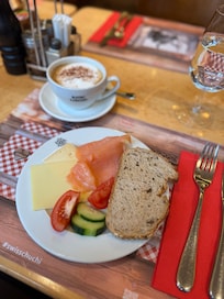 Breakfast - smoked salmon, bread options, selection of cheeses, fruits and veggies. Cappuccino
