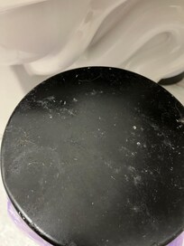 Urine-encrusted trash can lid