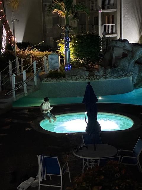 View of the hot tub and pool from the unit