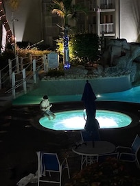 View of the hot tub and pool from the unit