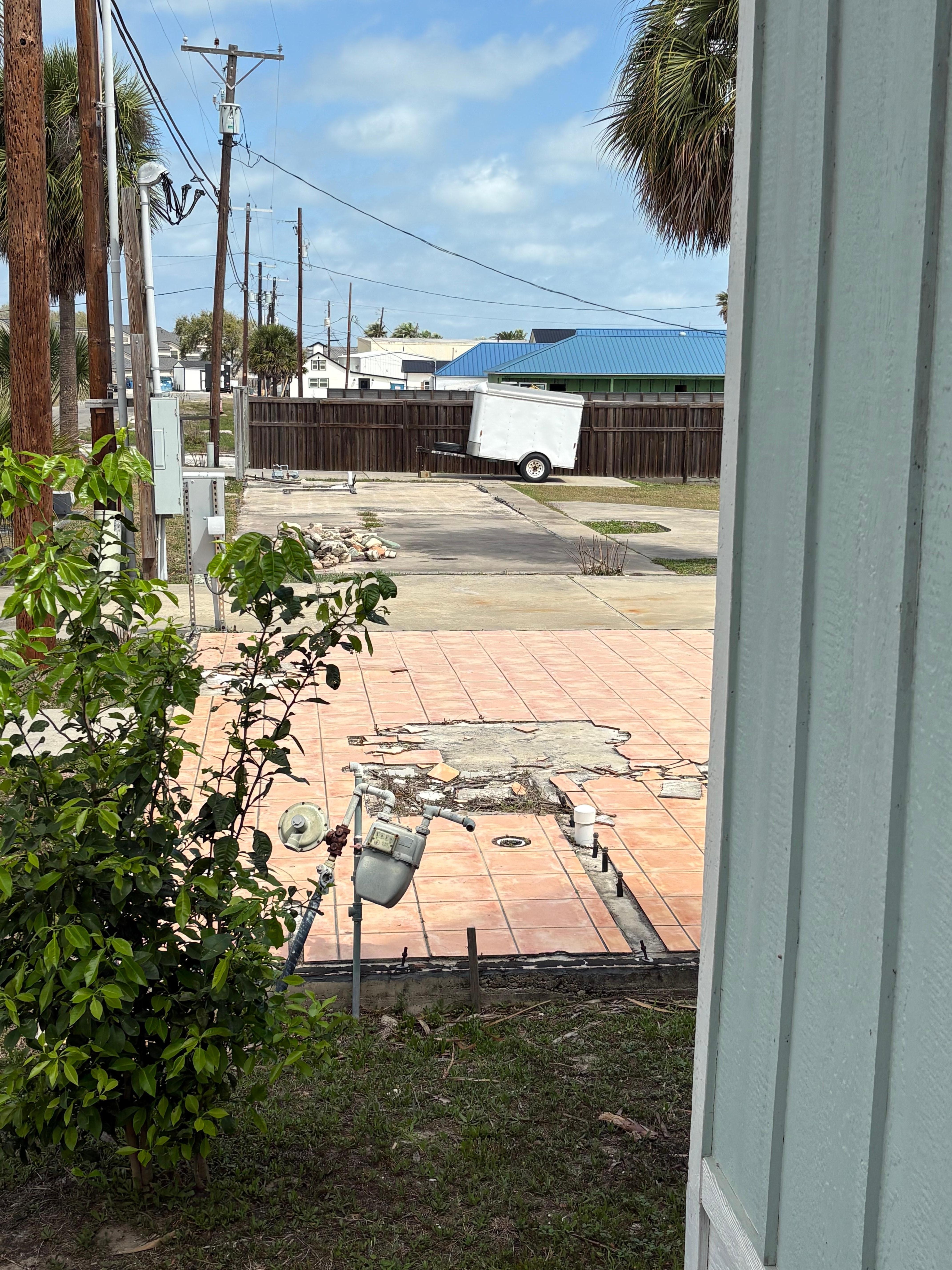 The property has broken tiles everywhere. Empty cement lots. Rundown property!
