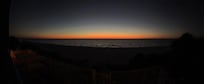 Panoramic sunset view from balcony.