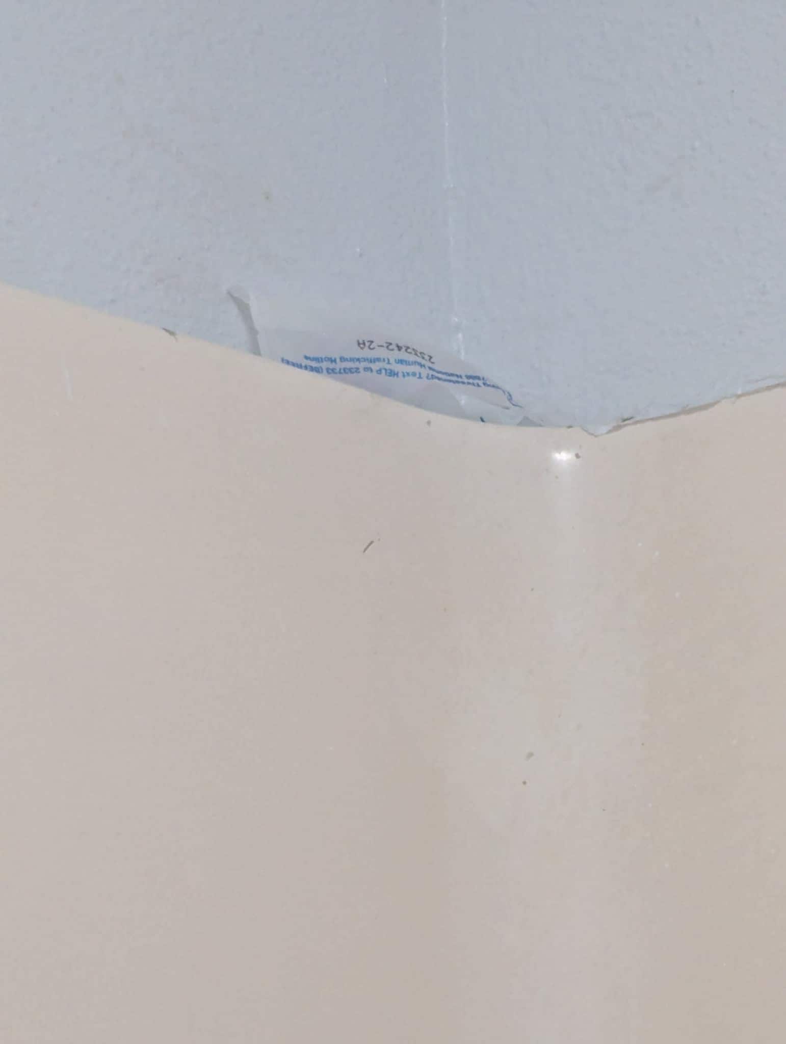 Bathtub with old soap wrapper 