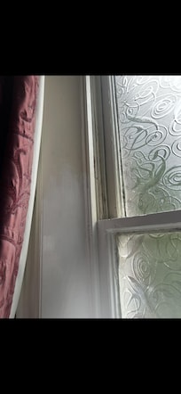 Dirt and cobwebs ln the window and paint work was patchy