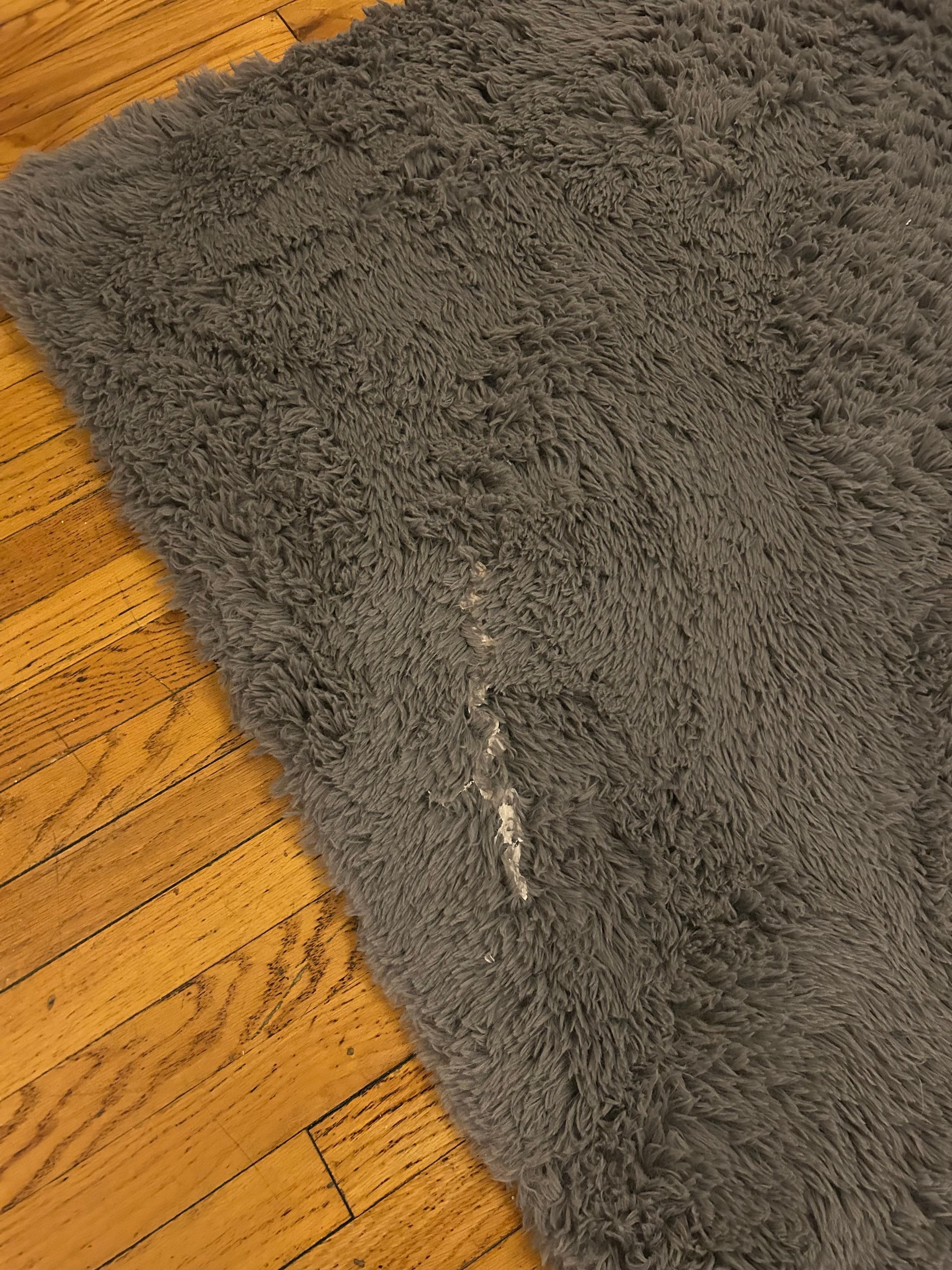 Large sticky stain on rug. Both area rugs felt and looked very dirty