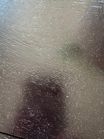 dust on one of the sofa tables
