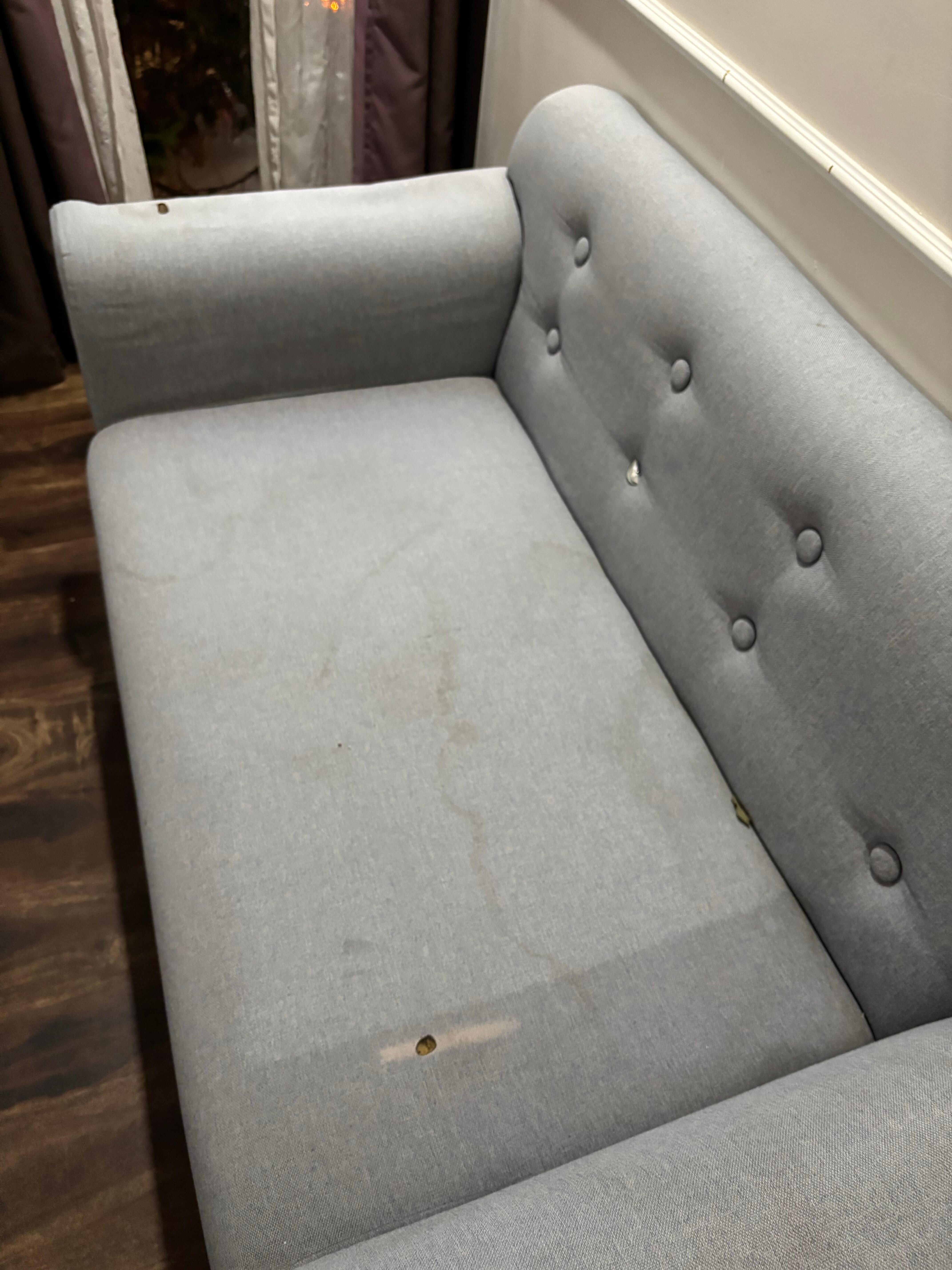 Replacement room given with dirty and torn sofa