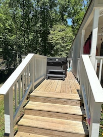 Side deck with hot tub.