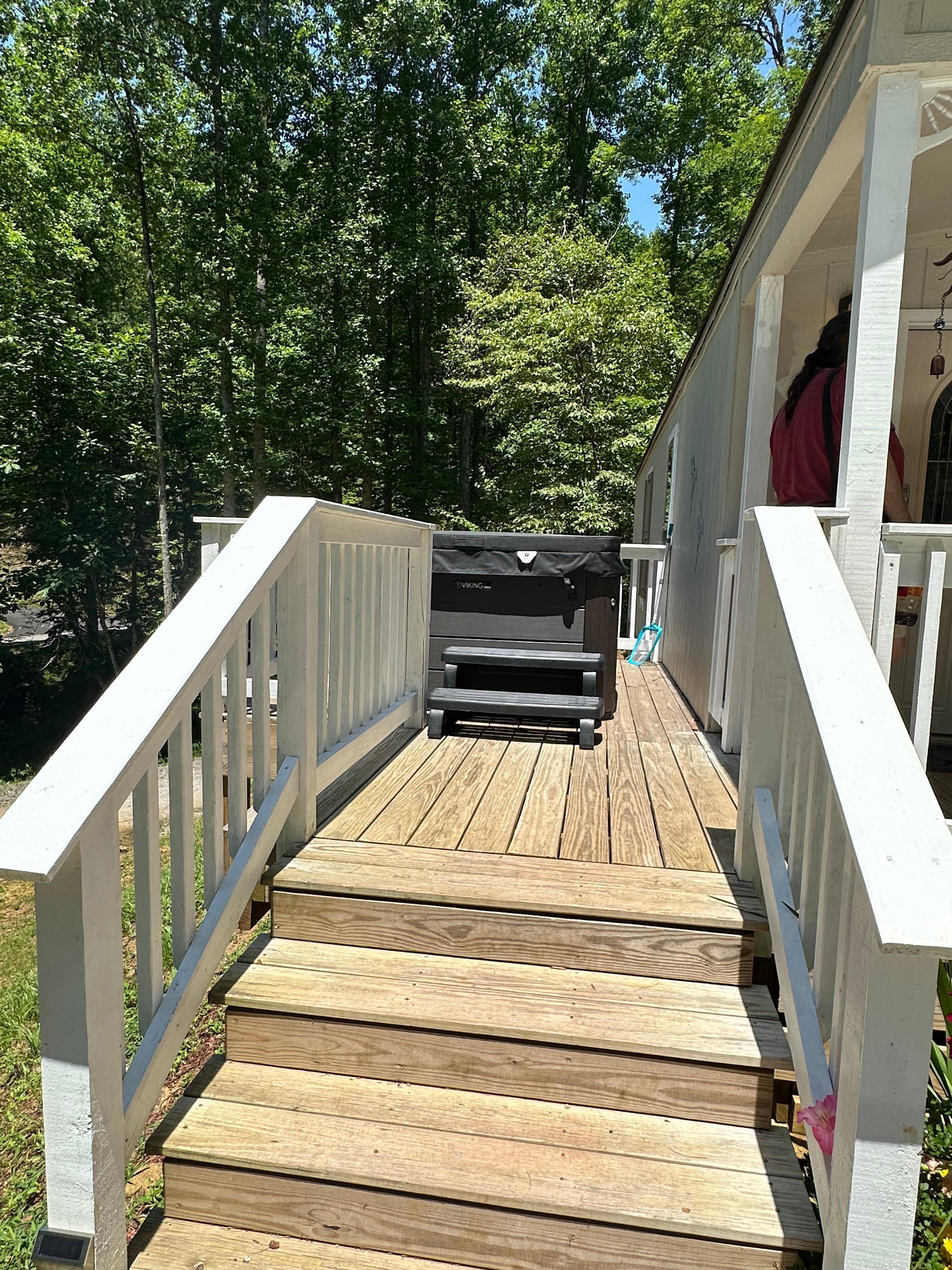 Side deck with hot tub.
