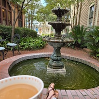 Enjoying a cup of coffee by the fountain on the patio!