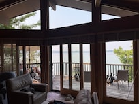 Three sliding glass doors and the two open windows at kitchen sink let breeze come through.